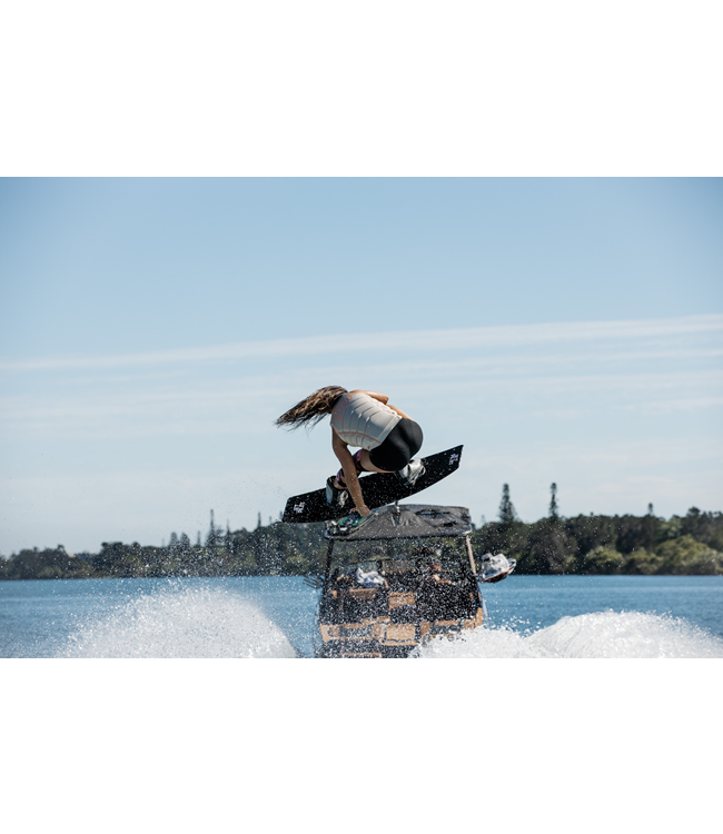 Jetpilot Pacer X1 Off White Womens Life Vest on-water wakeboard action showing flex panels
