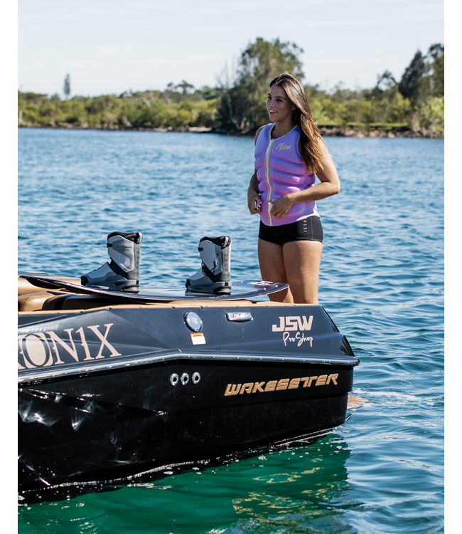 Jetpilot Pacer X1 Purple Womens Life Vest on-water wakeboard action showing panel flex