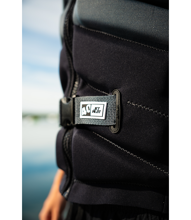 Jetpilot Busty X1 Black Mens Life Vest Sunn signature series lifestyle shot at the water