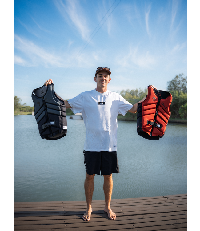 Jetpilot Busty X1 Black Mens Life Vest Sunn signature primary lifestyle hero shot of rider