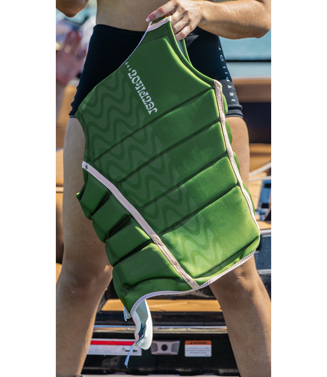 Jetpilot Luna X1 Olive Ladies Life Vest worn lifestyle shot of female rider near the water