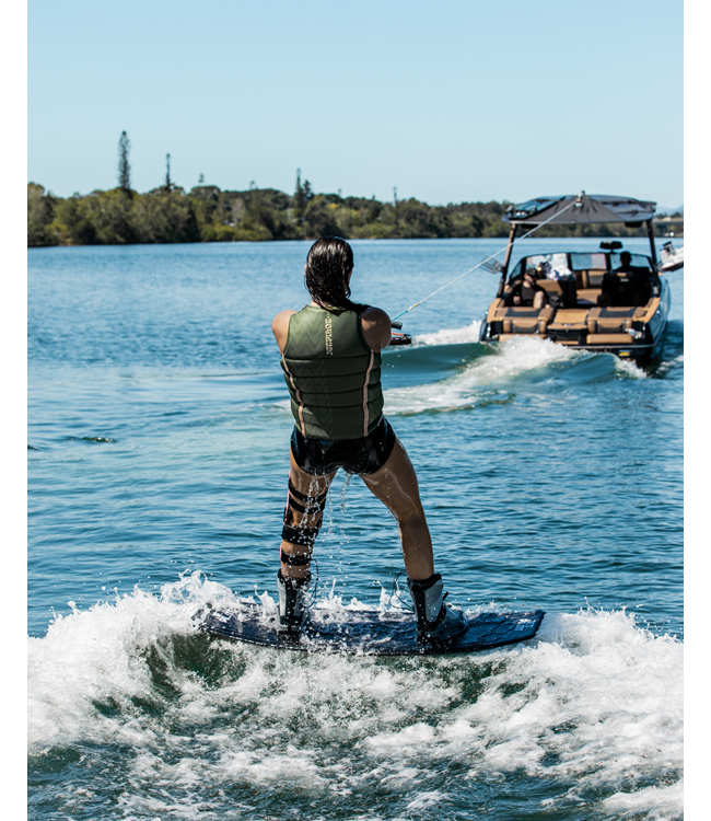Jetpilot Luna X1 Olive Ladies Life Vest rider closing lifestyle shot near water at sunset
