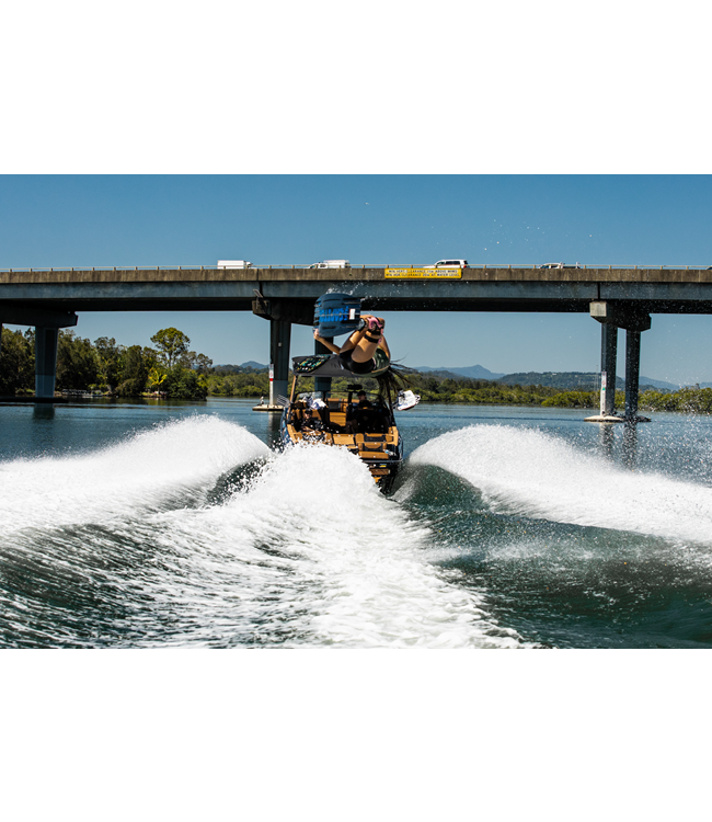 Jetpilot Luna X1 Olive Ladies Life Vest mid wakeboard ride showing full body articulation