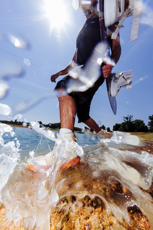Liquid Force Hook 6X Wakeboard Boots worn by a rider at the cable park during a session