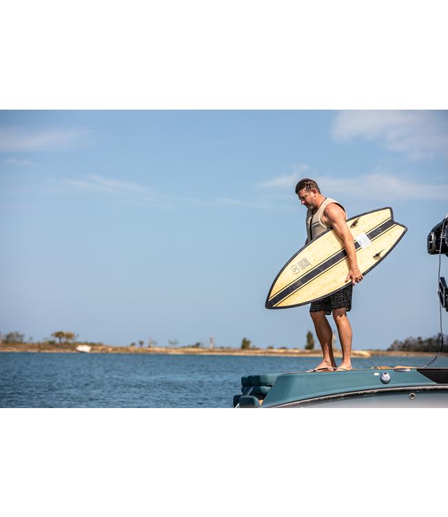 Ronix Fish Koal Classic Wakesurfer - rider standing on the boat platform holding the board