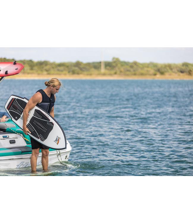 Ronix Sea Captain Wakesurfer - rider standing on the boat platform holding the white board
