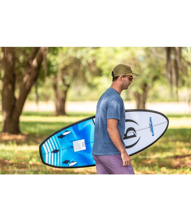 Ronix North Shore Wakesurfer - rider carrying the board across the grass under shady trees