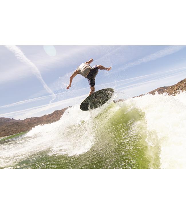 Ronix Osmo Skimmer Tuff Tech - rider stepping across the board off the top with desert hills behind