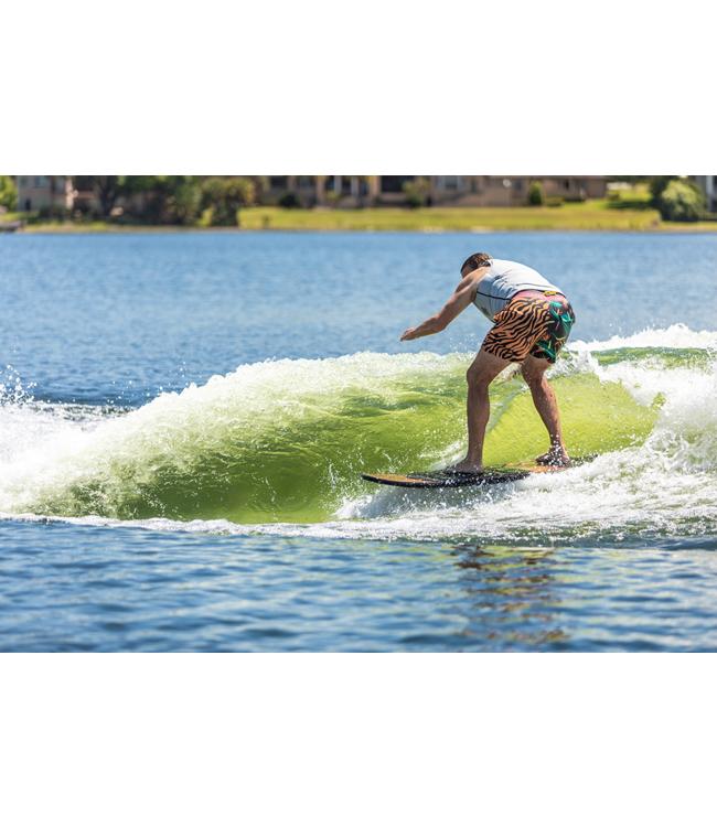 Ronix Wave King Skimmer - rider carving across the face of a clean green wave