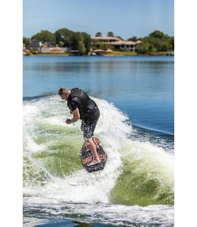 Ronix Wave King Skimmer - rider driving through a carve with the wake breaking behind