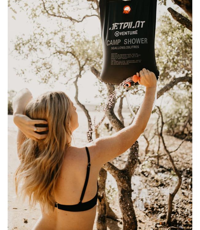 Jetpilot Venture Solar Camp Shower hanging full of water showing solar heating panel exposed to sun