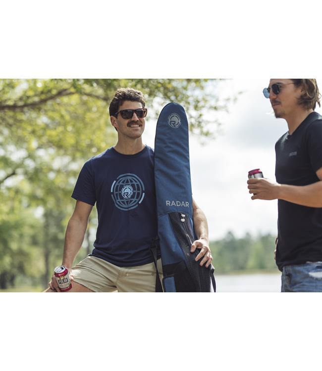Radar Padded Slalom Ski Bag lifestyle shot — rider carrying the padded slalom bag at the lake